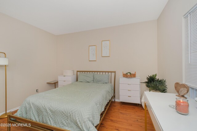 511 Coppola Dr, South Plainfield, NJ 07080 - bedroom featuring light wood-style flooring and baseboards