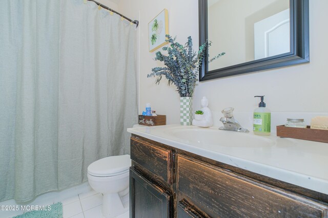 511 Coppola Dr, South Plainfield, NJ 07080 - full bathroom featuring vanity, tile patterned flooring, toilet, and a shower with curtain