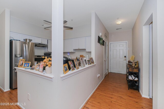 511 Coppola Dr, South Plainfield, NJ 07080 - corridor with light wood-style floors and baseboards