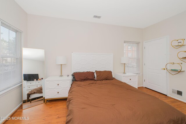 511 Coppola Dr, South Plainfield, NJ 07080 - bedroom featuring light wood finished floors and baseboards