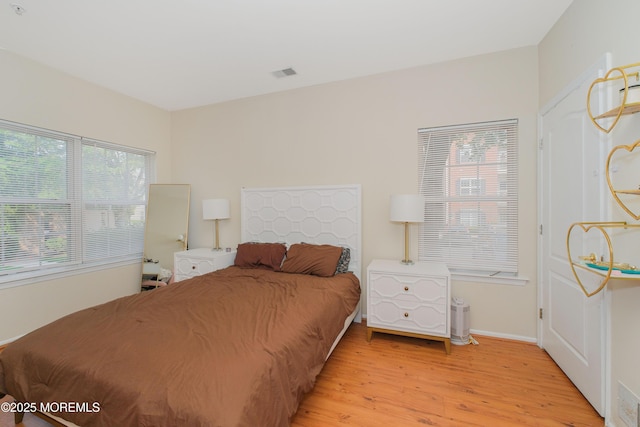 511 Coppola Dr, South Plainfield, NJ 07080 - bedroom featuring light wood-type flooring and baseboards