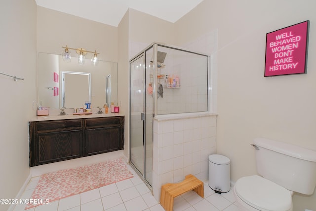 511 Coppola Dr, South Plainfield, NJ 07080 - full bathroom with toilet, vanity, a stall shower, and tile patterned flooring