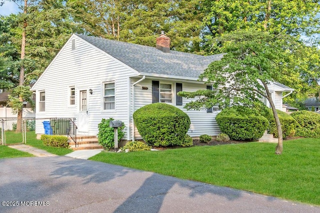 361 Meadowbrook Ave, Eatontown, NJ 07724 - view of front of house with roof with shingles and a chimney