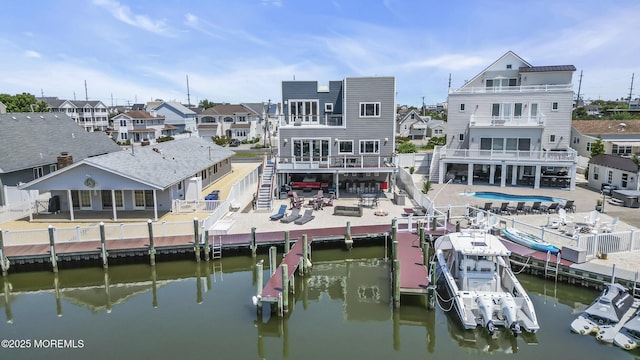 1639 Bay Blvd, Ortley Beach, NJ 08751 - rear view of house with a fenced backyard, stairway, a residential view, a patio area, and a water view