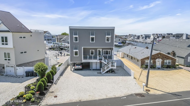 1639 Bay Blvd, Ortley Beach, NJ 08751 - view of front of house featuring stairs, a residential view, driveway, and a carport