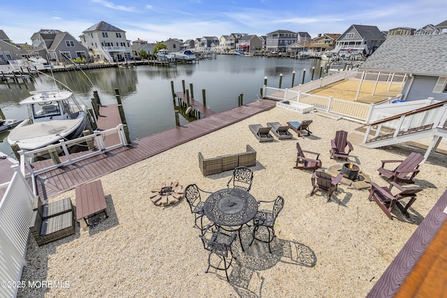 1639 Bay Blvd, Ortley Beach, NJ 08751 - dock with an outdoor fire pit, a residential view, a water view, and boat lift