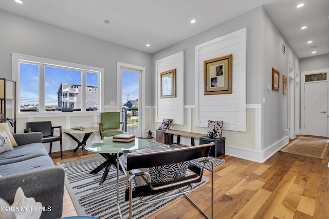 1639 Bay Blvd, Ortley Beach, NJ 08751 - living room featuring hardwood / wood-style floors, recessed lighting, wainscoting, and a decorative wall