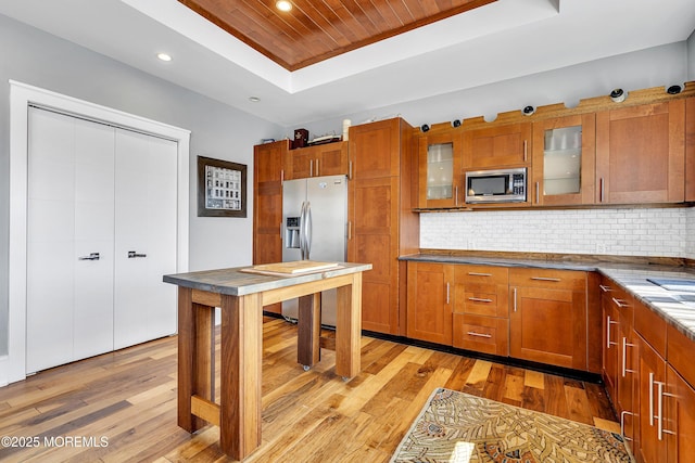1639 Bay Blvd, Ortley Beach, NJ 08751 - kitchen featuring stainless steel appliances, a tray ceiling, brown cabinets, recessed lighting, and light wood-type flooring