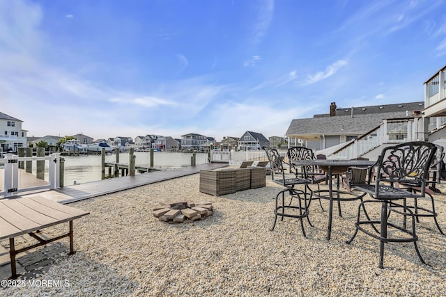 1639 Bay Blvd, Ortley Beach, NJ 08751 - view of patio with a residential view, an outdoor fire pit, a dock, and a water view