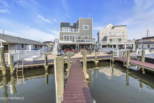 1639 Bay Blvd, Ortley Beach, NJ 08751 - dock featuring stairway, a water view, and a patio area