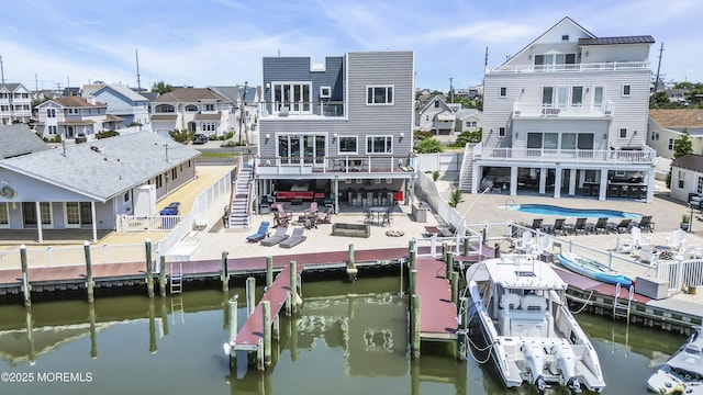 1639 Bay Blvd, Ortley Beach, NJ 08751 - back of house featuring stairs, a fenced backyard, a water view, and a residential view