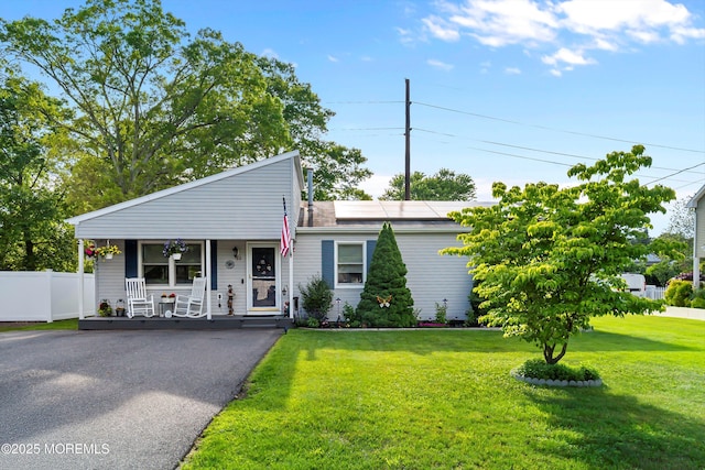 33 Oak Ln, Little Egg Harbor, NJ 08087 - view of front facade featuring covered porch and roof mounted solar panels