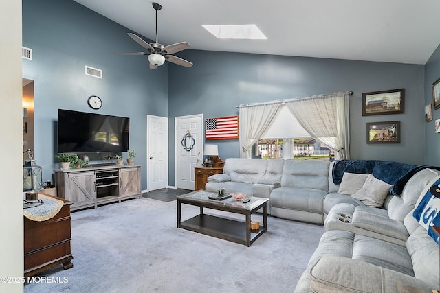 33 Oak Ln, Little Egg Harbor, NJ 08087 - living room featuring high vaulted ceiling, ceiling fan, a skylight, and carpet floors