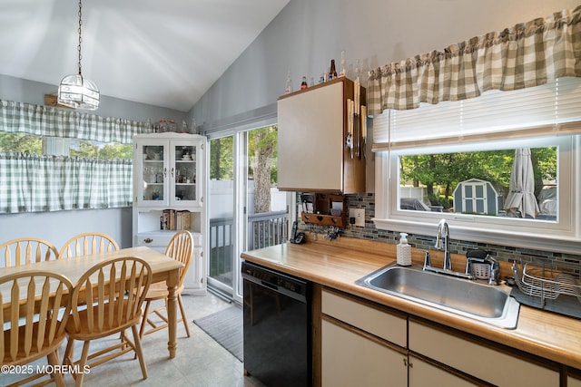 33 Oak Ln, Little Egg Harbor, NJ 08087 - kitchen with dishwasher, a sink, lofted ceiling, decorative backsplash, and light countertops