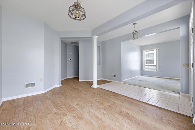 18 Valley Stream Pl, Barnegat, NJ 08005 - spare room featuring decorative columns, wood finished floors, baseboards, and a chandelier