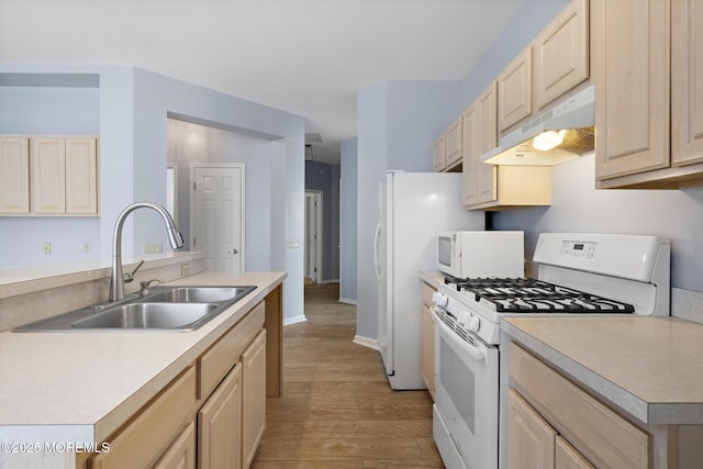 18 Valley Stream Pl, Barnegat, NJ 08005 - kitchen featuring under cabinet range hood, light brown cabinetry, white appliances, a sink, and light wood-style floors