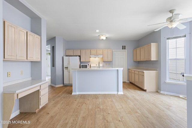18 Valley Stream Pl, Barnegat, NJ 08005 - kitchen featuring white appliances, light brown cabinetry, under cabinet range hood, light countertops, and a sink