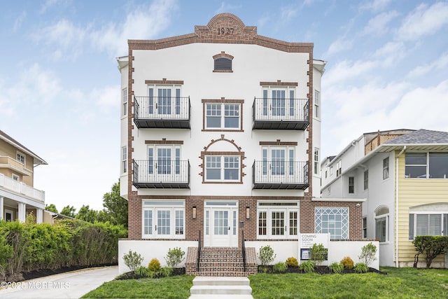 205 Edgemont Dr Unit 2, Loch Arbour Village, NJ 07711 - view of front facade with stucco siding
