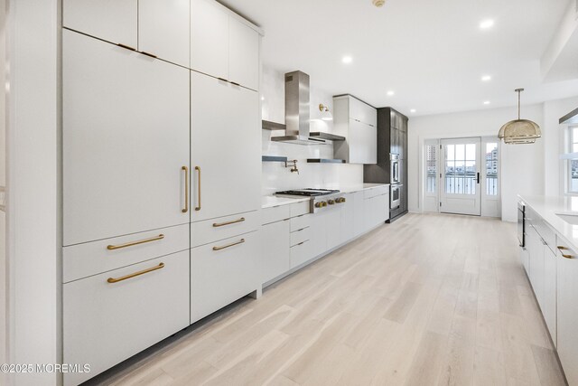 205 Edgemont Dr Unit 2, Loch Arbour Village, NJ 07711 - kitchen featuring modern cabinets, ventilation hood, gas cooktop, light wood-type flooring, and light countertops