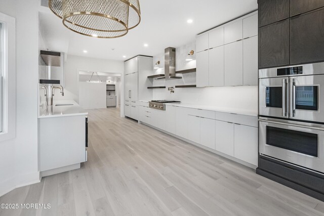 205 Edgemont Dr Unit 2, Loch Arbour Village, NJ 07711 - kitchen with island range hood, modern cabinets, stainless steel appliances, and recessed lighting