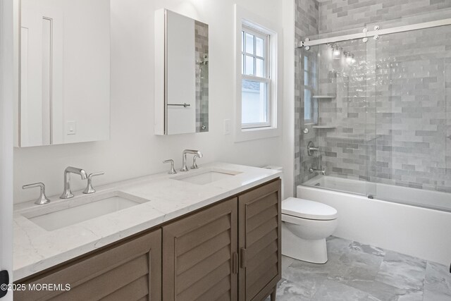 205 Edgemont Dr Unit 2, Loch Arbour Village, NJ 07711 - bathroom with toilet, double vanity, shower / bath combination with glass door, and marble finish flooring