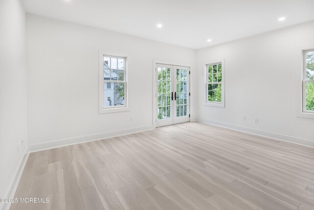 205 Edgemont Dr Unit 2, Loch Arbour Village, NJ 07711 - empty room featuring plenty of natural light, french doors, recessed lighting, light wood finished floors, and baseboards