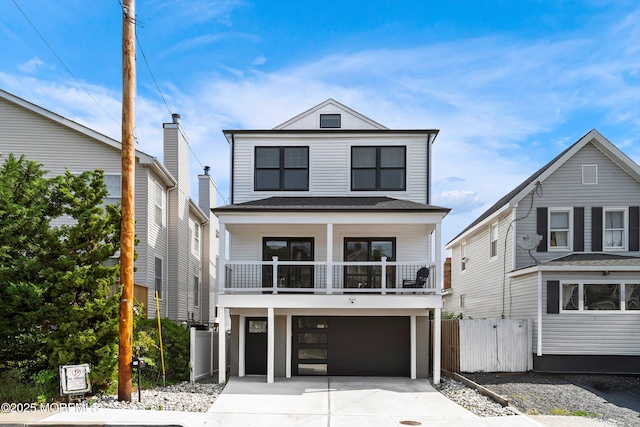 72 4th St, Highlands, NJ 07732 - view of front of house with driveway, a garage, and a balcony