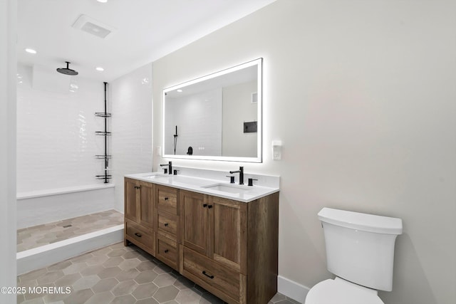72 4th St, Highlands, NJ 07732 - full bath featuring double vanity, tile patterned floors, tiled shower, toilet, and recessed lighting
