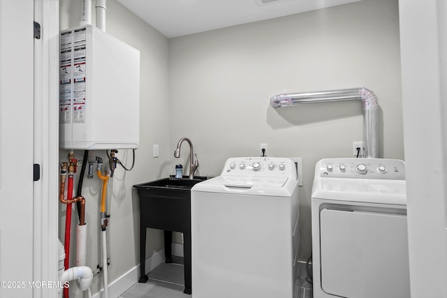 72 4th St, Highlands, NJ 07732 - laundry room with water heater, washer and dryer, and baseboards