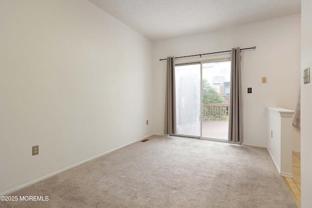62 Cohasset Ct, Holmdel, NJ 07733 - unfurnished room featuring light colored carpet, a textured ceiling, and baseboards