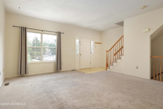 62 Cohasset Ct, Holmdel, NJ 07733 - entryway with carpet and stairs