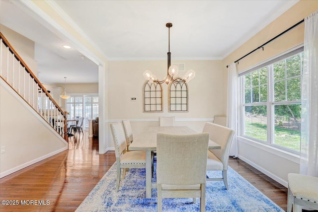 10 Unity Ct, Middletown, NJ 07748 - dining room with stairs, a chandelier, wood finished floors, baseboards, and ornamental molding
