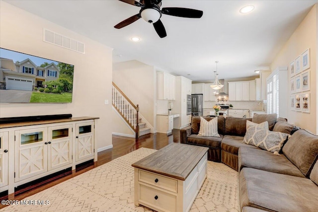 10 Unity Ct, Middletown, NJ 07748 - living area with a ceiling fan, stairway, wood finished floors, recessed lighting, and baseboards