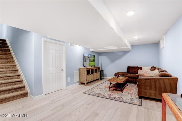 10 Unity Ct, Middletown, NJ 07748 - living area featuring stairway, light wood-style floors, and baseboards