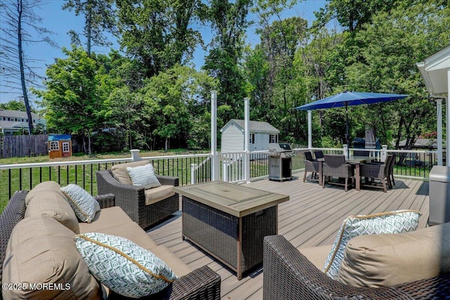 10 Unity Ct, Middletown, NJ 07748 - wooden terrace with outdoor lounge area, outdoor dining area, area for grilling, and view of wooded area
