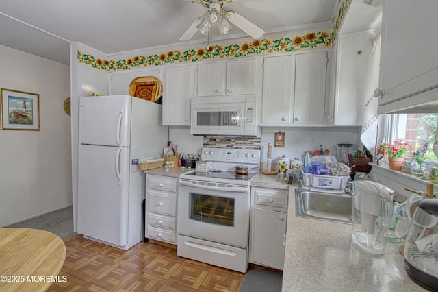 186 Laurel Pl Unit B, Whiting, NJ 08759 - kitchen with white appliances, a ceiling fan, light countertops, white cabinets, and crown molding