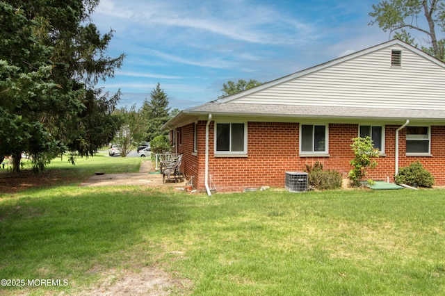 186 Laurel Pl Unit B, Whiting, NJ 08759 - view of property exterior featuring a yard, brick siding, and cooling unit