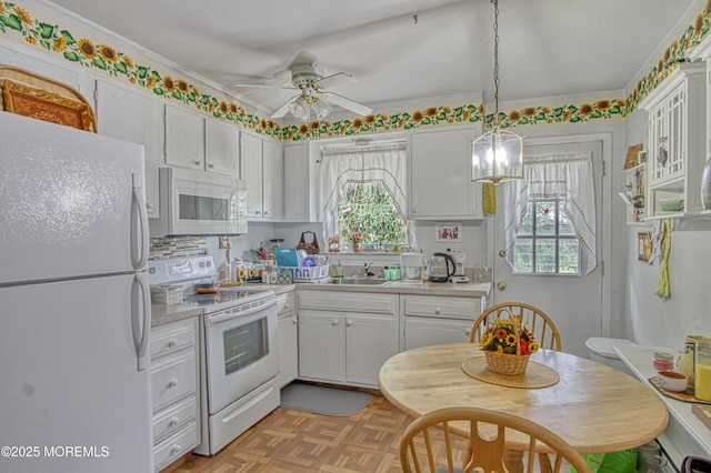 186 Laurel Pl Unit B, Whiting, NJ 08759 - kitchen featuring white appliances, light countertops, plenty of natural light, and crown molding