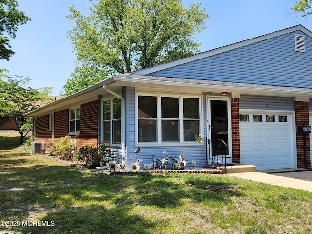 10-A Snowberry Ln, Whiting, NJ 08759 - ranch-style house with brick siding, a garage, a front yard, and central air condition unit