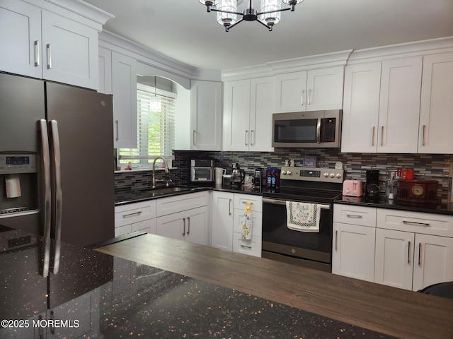 10-A Snowberry Ln, Whiting, NJ 08759 - kitchen featuring appliances with stainless steel finishes, a sink, a chandelier, and white cabinetry