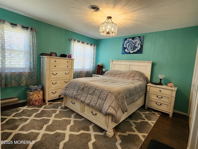 10-A Snowberry Ln, Whiting, NJ 08759 - bedroom with a baseboard radiator, a chandelier, and wood finished floors