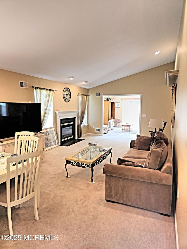 12 Skylark Ln, Lakewood, NJ 08701 - carpeted living area featuring a glass covered fireplace and lofted ceiling