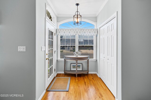 7 Brown Ave, Lavallette, NJ 08735 - doorway to outside with a chandelier, crown molding, wood finished floors, and baseboards