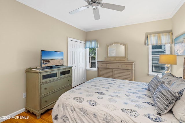 7 Brown Ave, Lavallette, NJ 08735 - bedroom with ornamental molding, wood finished floors, a closet, baseboards, and a ceiling fan