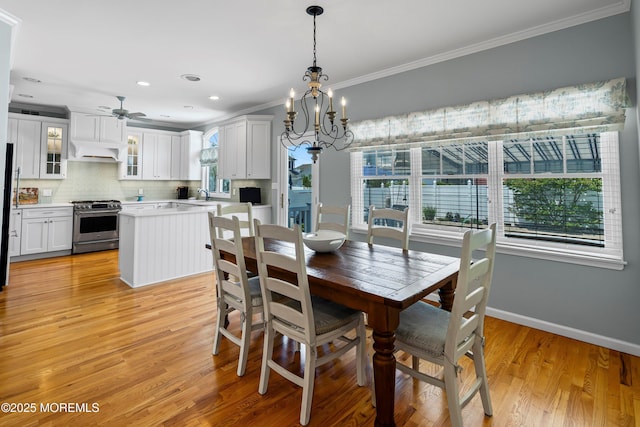 7 Brown Ave, Lavallette, NJ 08735 - dining area featuring crown molding, a chandelier, light wood-style floors, a ceiling fan, and baseboards