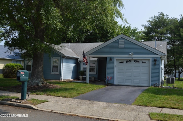 38 Sheffield Dr, Forked River, NJ 08731 - ranch-style house featuring asphalt driveway, an attached garage, a front yard, and a shingled roof