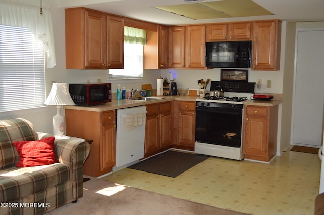 38 Sheffield Dr, Forked River, NJ 08731 - kitchen featuring black microwave, gas range oven, dishwasher, and light countertops