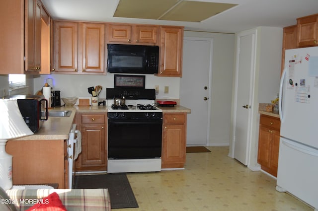 38 Sheffield Dr, Forked River, NJ 08731 - kitchen featuring black microwave, freestanding refrigerator, range, light floors, and light countertops