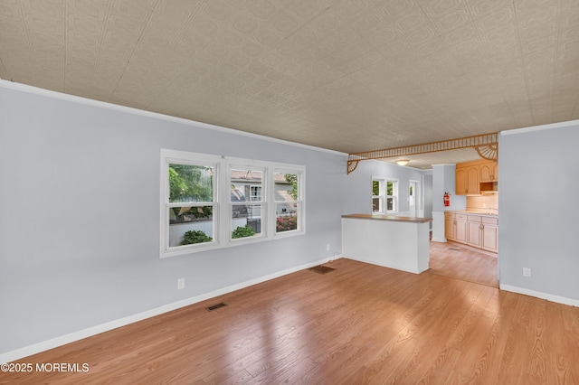23 Southwind Cir, Jackson, NJ 08527 - unfurnished living room with light wood-style floors, ornamental molding, baseboards, and an ornate ceiling