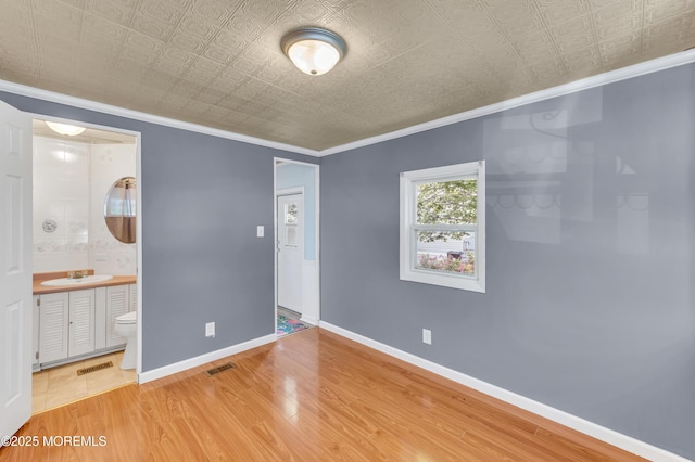 23 Southwind Cir, Jackson, NJ 08527 - unfurnished bedroom with ornamental molding, wood finished floors, an ornate ceiling, a sink, and baseboards